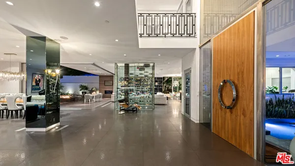 a bathroom with a sink mirror and a shower