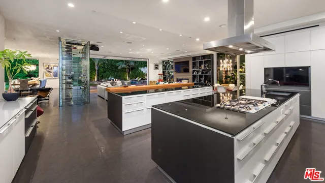 a bathroom with a sink a large mirror and a shower