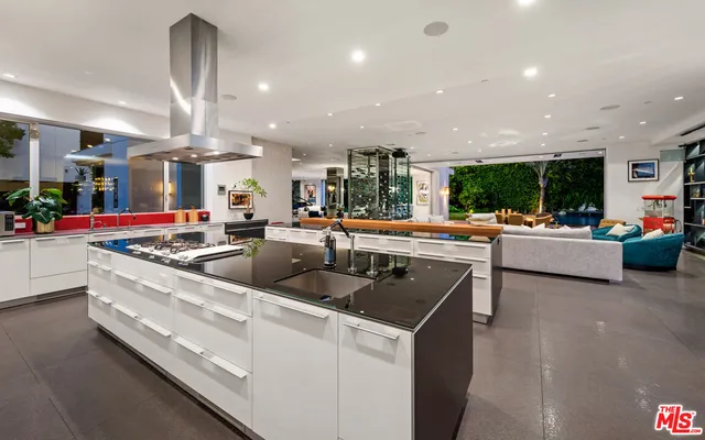 a bedroom with furniture and a large window