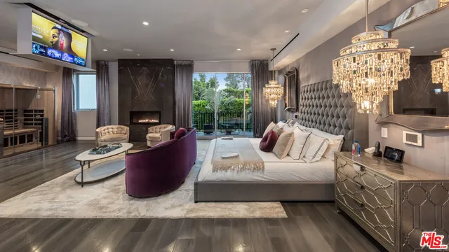 a living room with fireplace furniture and a flat screen tv