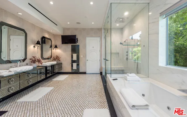a view of a patio with table and chairs potted plants with wooden floor and fence
