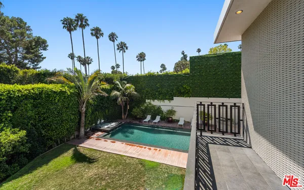 a front view of a house with a yard table and chairs