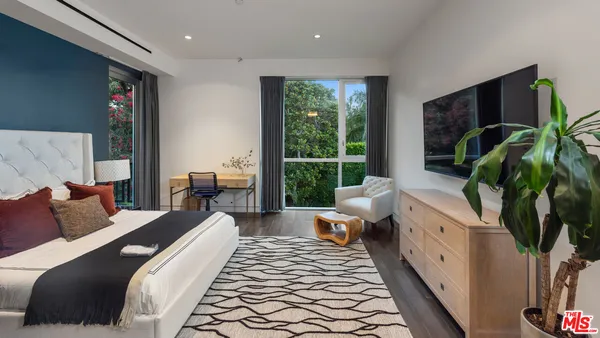 a view of a house with roof deck and sitting area