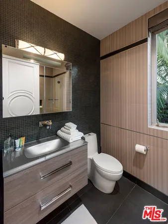 a bedroom with furniture and a wooden floor