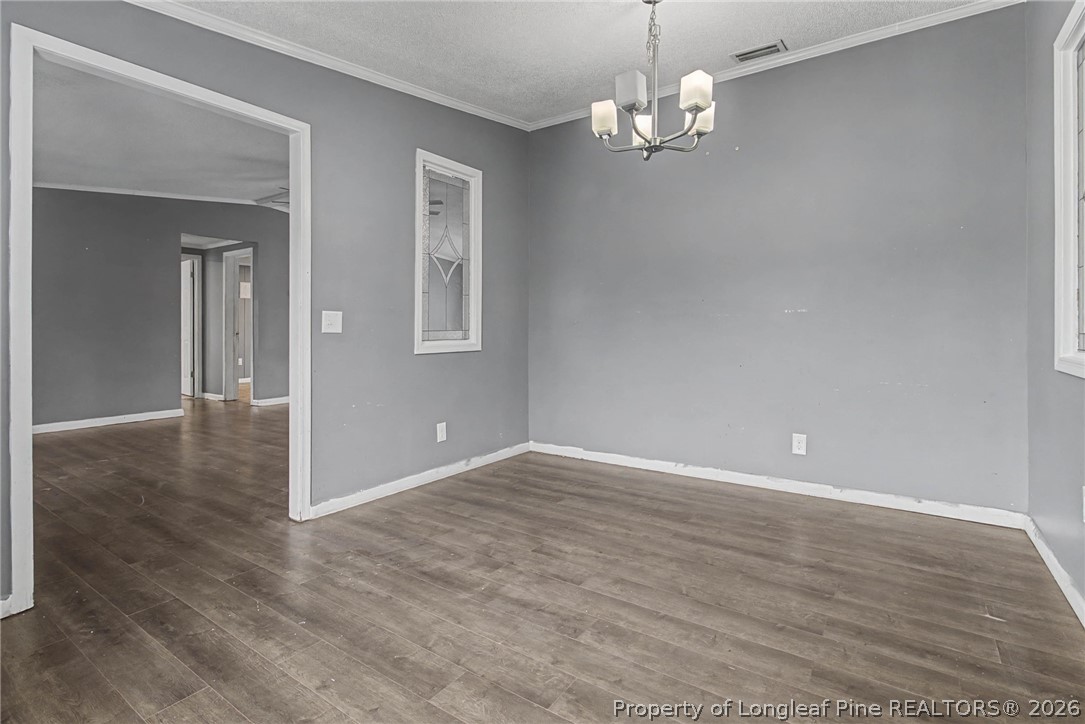 1512 Seabrook School Road Fayetteville, NC 28312 - Photo 19 of 30 wooden floor in an empty room with a window
