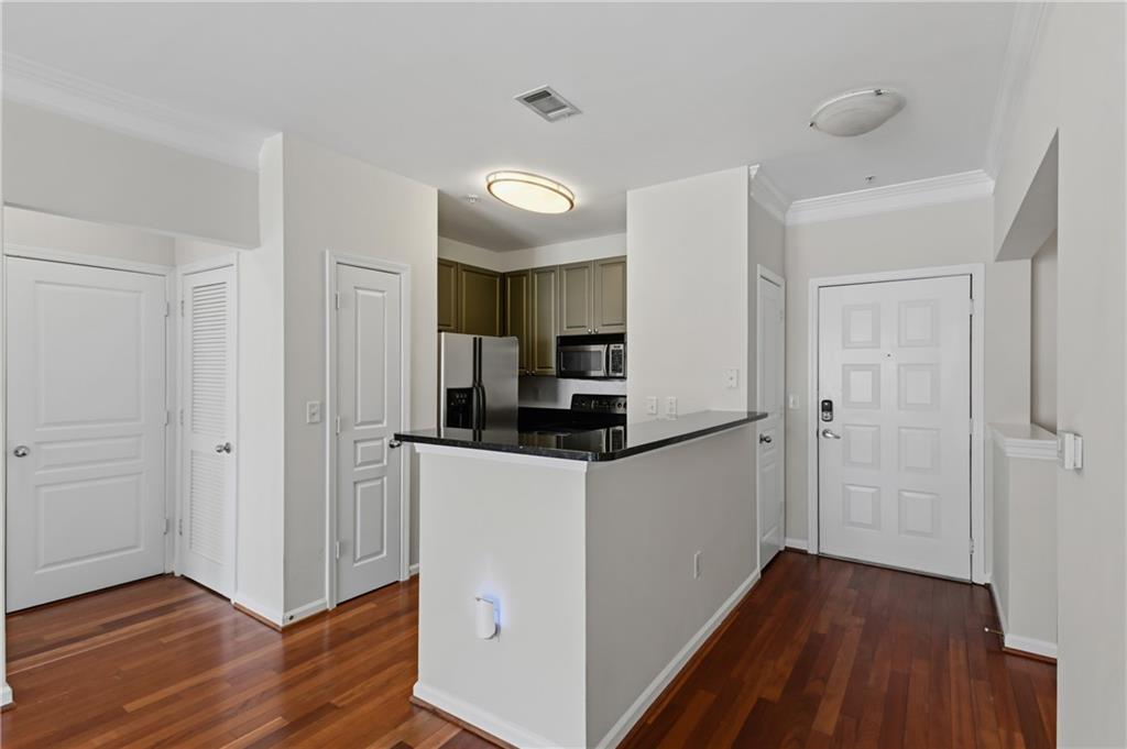 10 Perimeter Summit Boulevard, Unit 3311 Atlanta, GA 30319 - Photo 53 of 68 a kitchen with stainless steel appliances granite countertop a refrigerator and a stove top oven