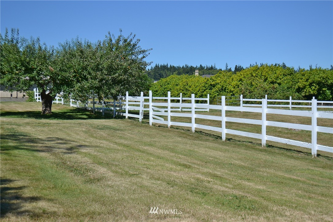 5791 Double Bluff Road Freeland, WA 98249 - Photo 2 of 25 a view of a yard with wooden fence