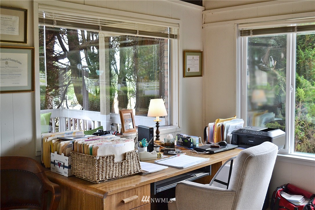 5791 Double Bluff Road Freeland, WA 98249 - Photo 11 of 25 a living room with furniture and a large window