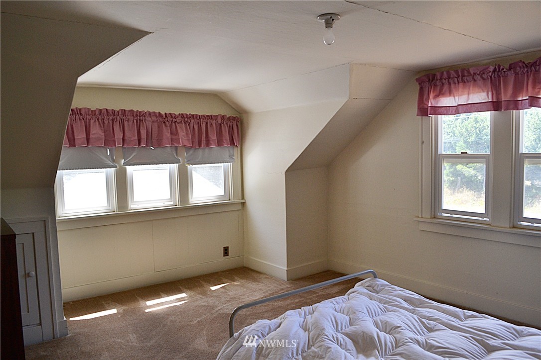 5791 Double Bluff Road Freeland, WA 98249 - Photo 14 of 25 a bedroom with a bed and window