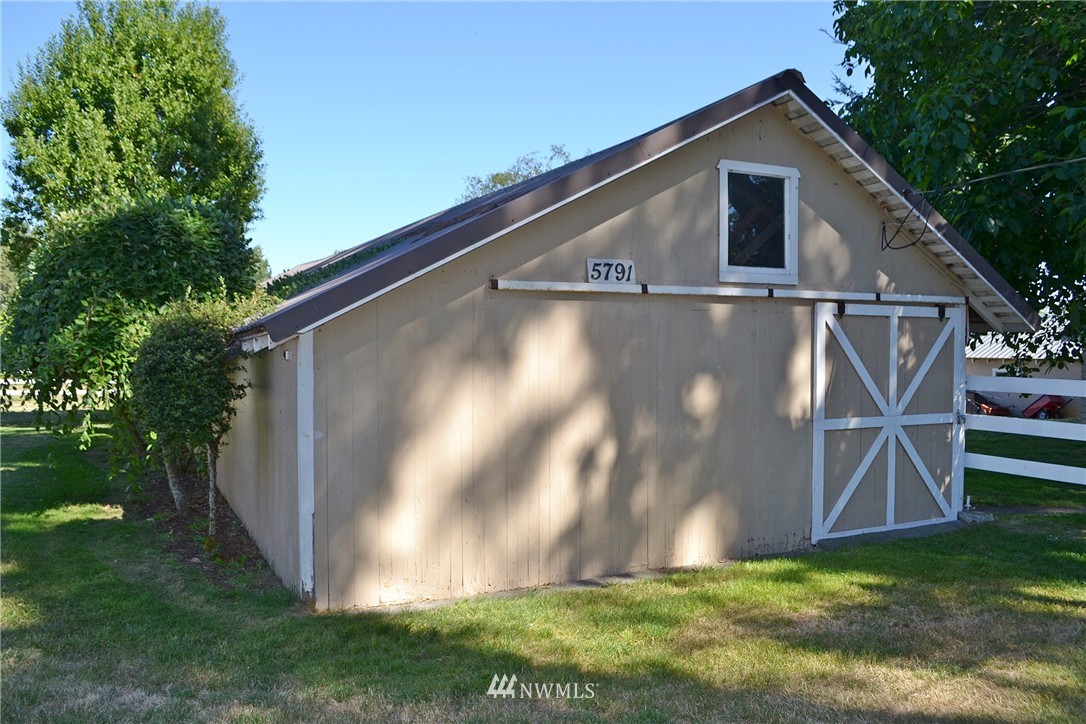 5791 Double Bluff Road Freeland, WA 98249 - Photo 19 of 25 a front view of house with garden