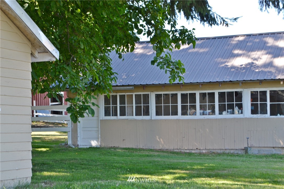 5791 Double Bluff Road Freeland, WA 98249 - Photo 20 of 25 a front view of a house with a yard and a garden