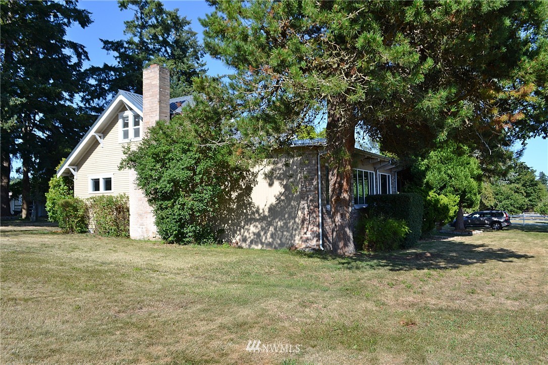 5791 Double Bluff Road Freeland, WA 98249 - Photo 3 of 25 a view of a house with a tree and plants