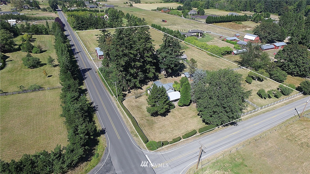 5791 Double Bluff Road Freeland, WA 98249 - Photo 7 of 25 a view of a garden with an outdoor seating