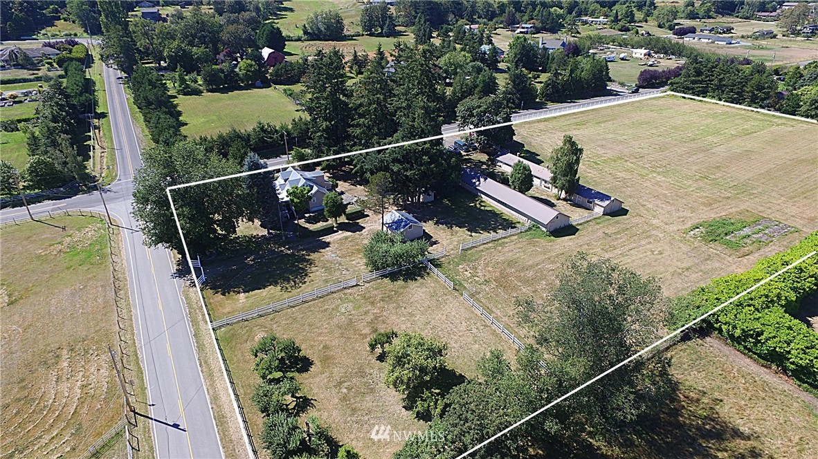 5791 Double Bluff Road Freeland, WA 98249 - Photo 8 of 25 an aerial view of a house with a swimming pool