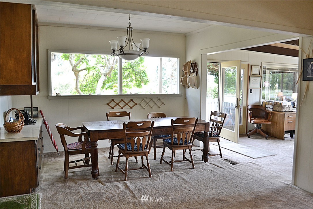 5791 Double Bluff Road Freeland, WA 98249 - Photo 10 of 25 a view of a dining room with furniture window and outside view