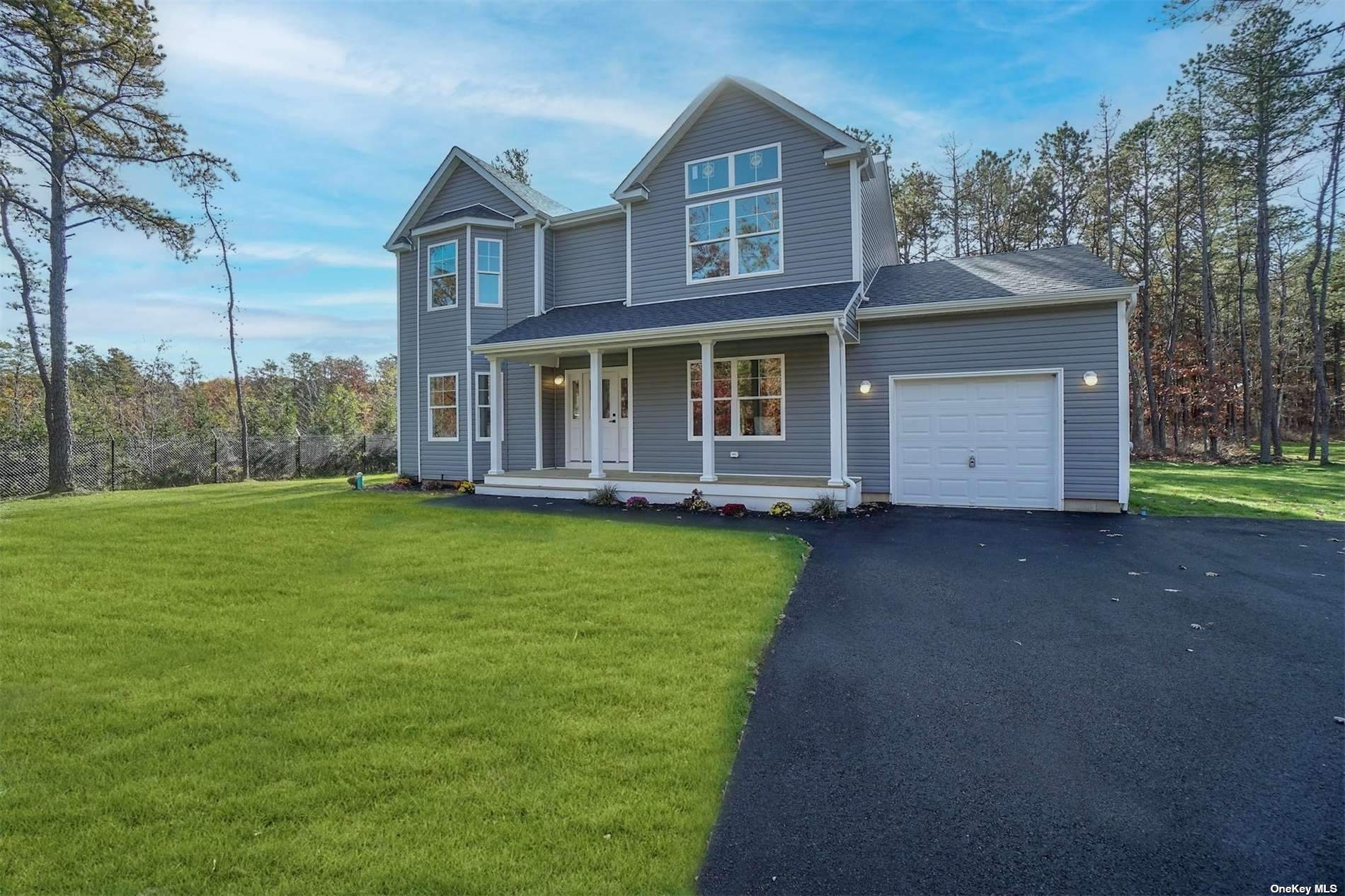 150 Gull Dip Road Ridge, NY 11961 - Photo 1 of 1 a view of an house with backyard space and garden