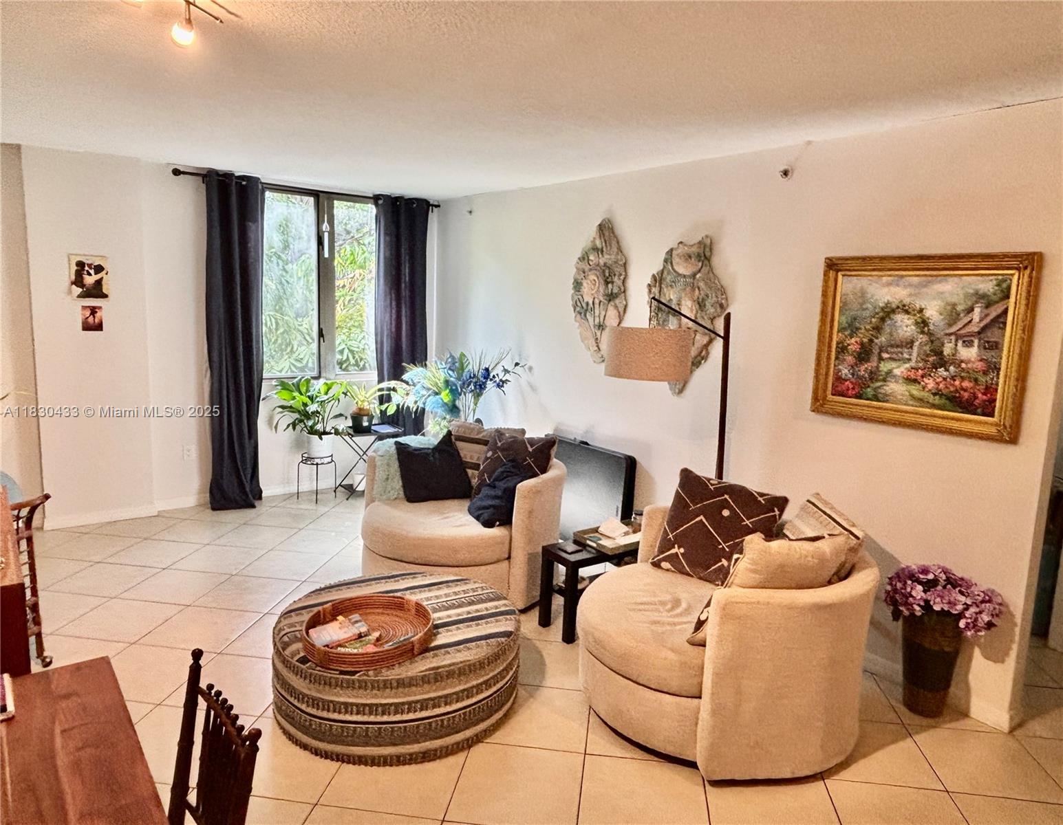 2630 Southwest 28th Street, Unit 34 Miami, FL 33133 - Photo 11 of 26 a living room with furniture and a large window