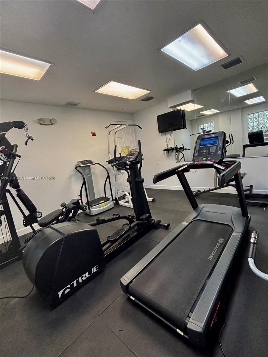 2630 Southwest 28th Street, Unit 34 Miami, FL 33133 - Photo 26 of 26 a view of a room with gym equipment
