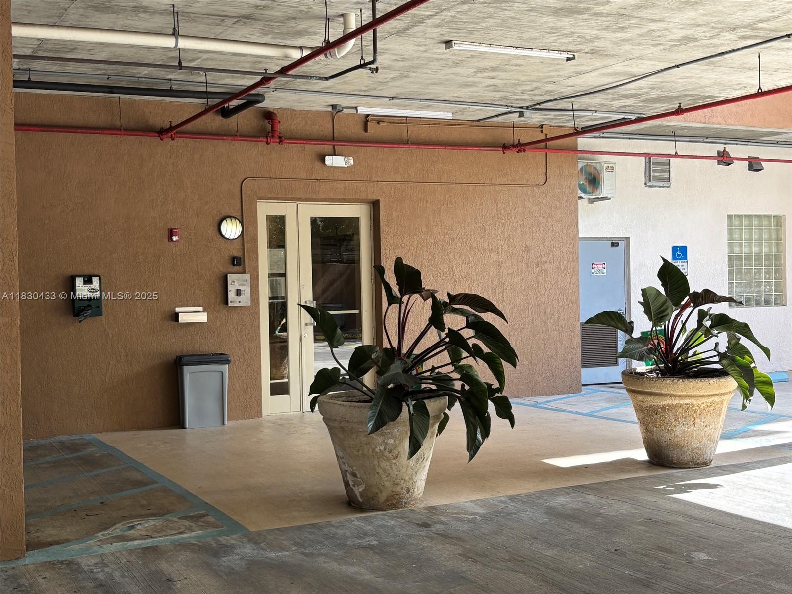 2630 Southwest 28th Street, Unit 34 Miami, FL 33133 - Photo 5 of 26 a view of a blue and white wooden door