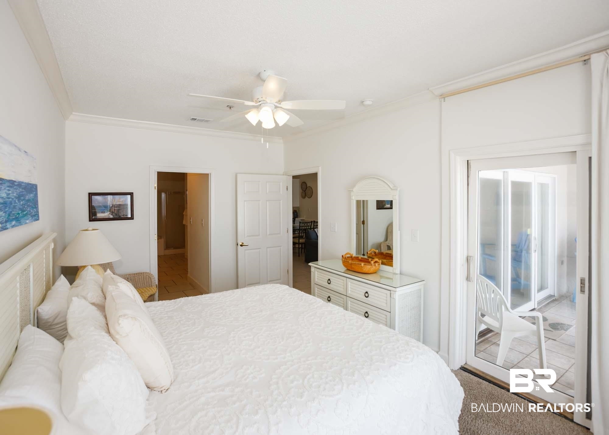 28910 Perdido Beach Boulevard, Unit 4B Orange Beach, AL 36561 - Photo 21 of 48 Bedroom with visible vents, crown molding, connected bathroom, a ceiling fan, and access to exterior