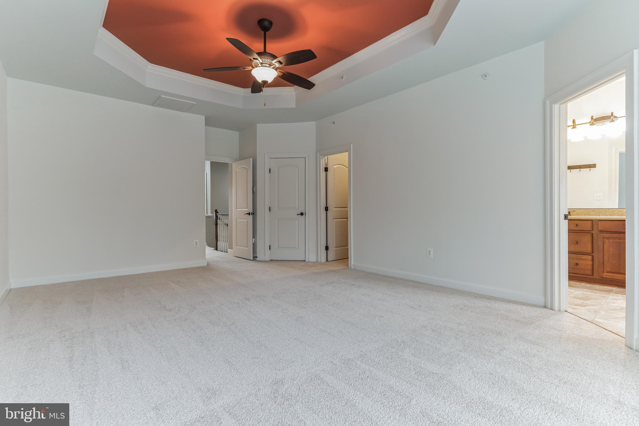 4927 Collingtons Bounty Drive Bowie, MD 20720 - Photo 20 of 38 an empty room with a chandelier fan and windows