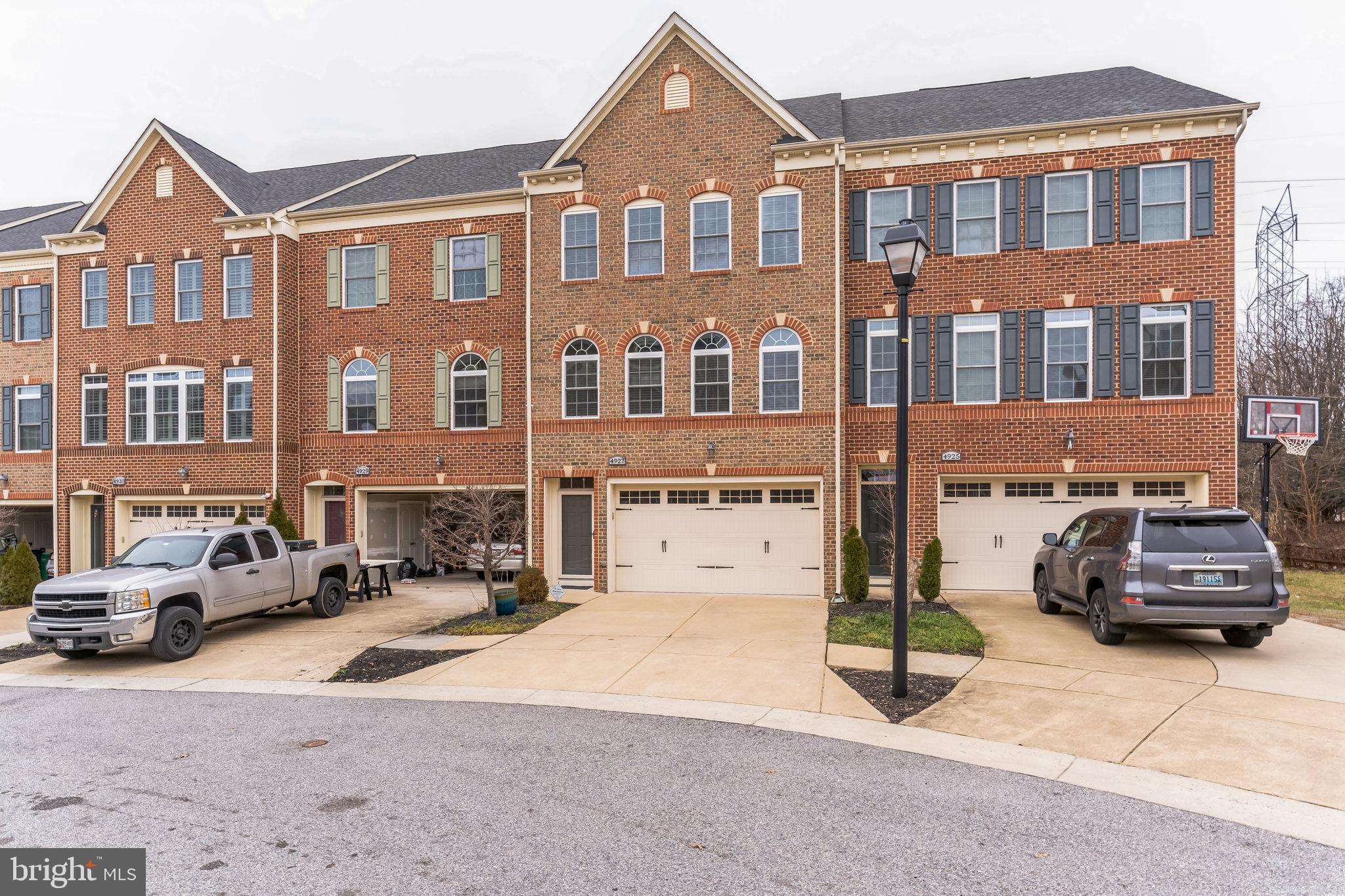 4927 Collingtons Bounty Drive Bowie, MD 20720 - Photo 38 of 38 a front view of a building with cars parked
