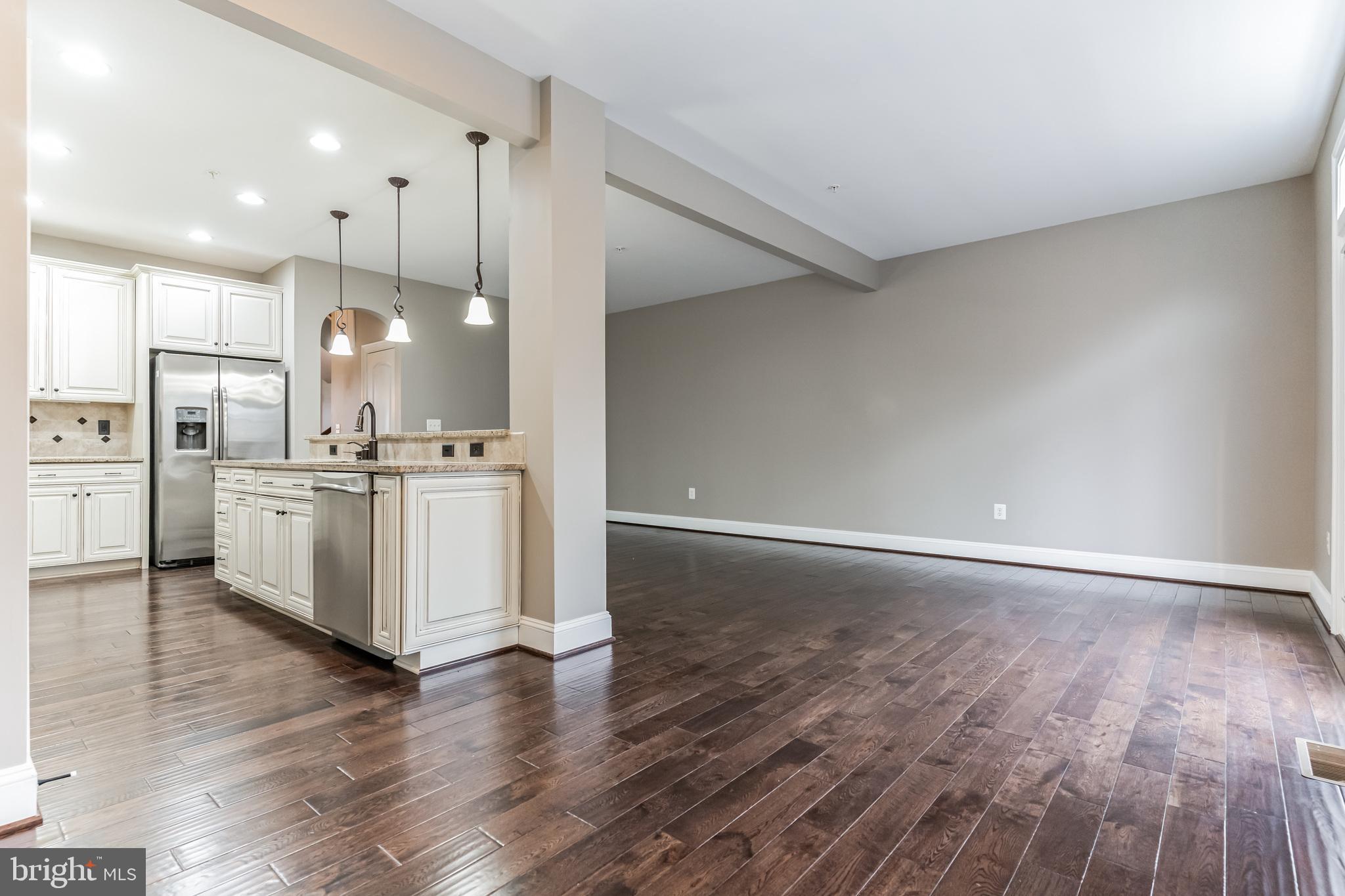 4927 Collingtons Bounty Drive Bowie, MD 20720 - Photo 5 of 38 a view of kitchen with wooden floor and window
