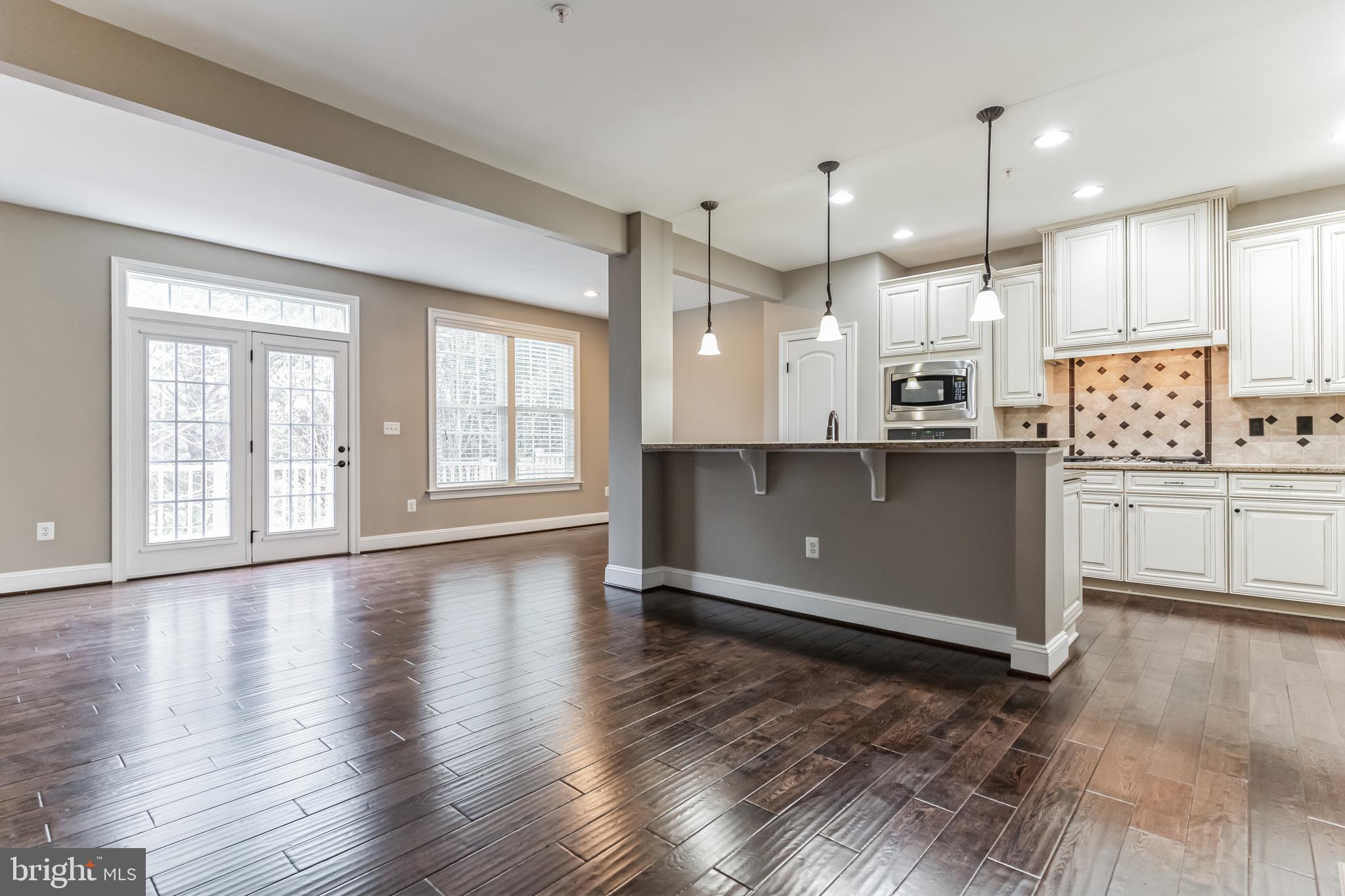 4927 Collingtons Bounty Drive Bowie, MD 20720 - Photo 6 of 38 a view of kitchen with cabinets and wooden floor
