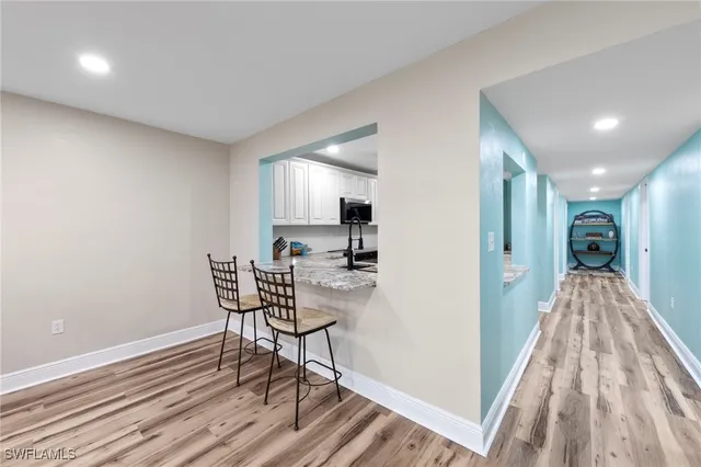 a view of a livingroom with furniture and wooden floor