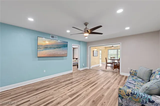 a bedroom with bed and a large window