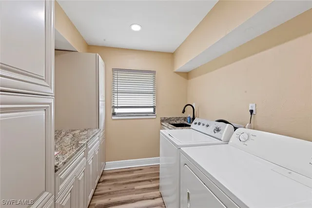 a utility room with a window dryer and washer