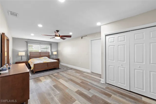 a bedroom with a bed and a dresser