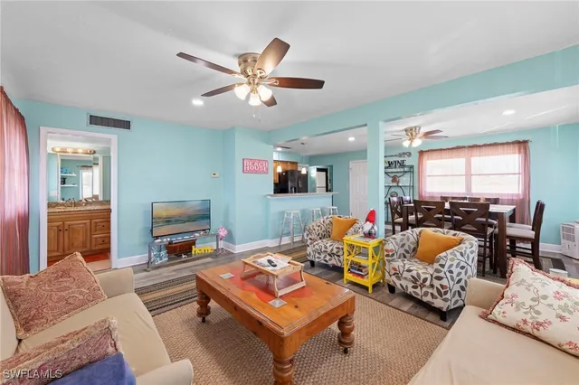 a bathroom with a sink a toilet and shower curtain