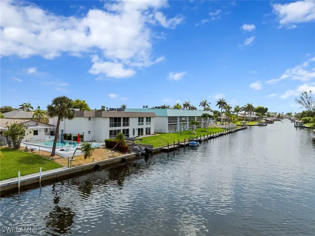 a view of house with outdoor space patio and swimming pool