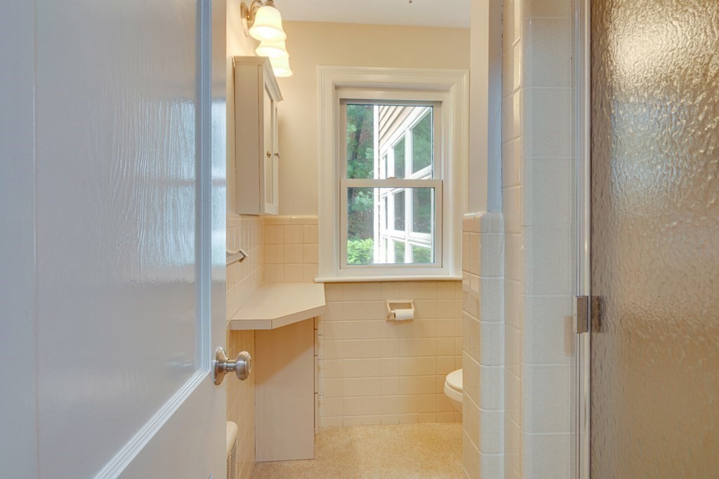 65 Longfellow Road Newton, MA 02462 - Photo 17 of 38 a bathroom with a window