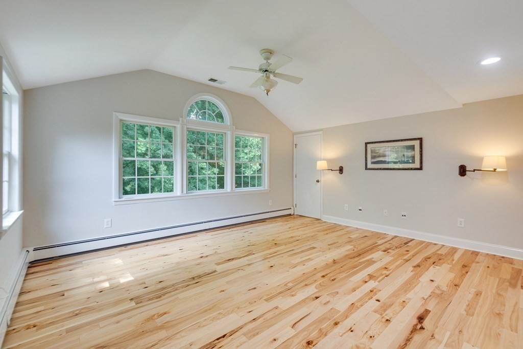 65 Longfellow Road Newton, MA 02462 - Photo 18 of 38 a view of an empty room with a window and wooden floor