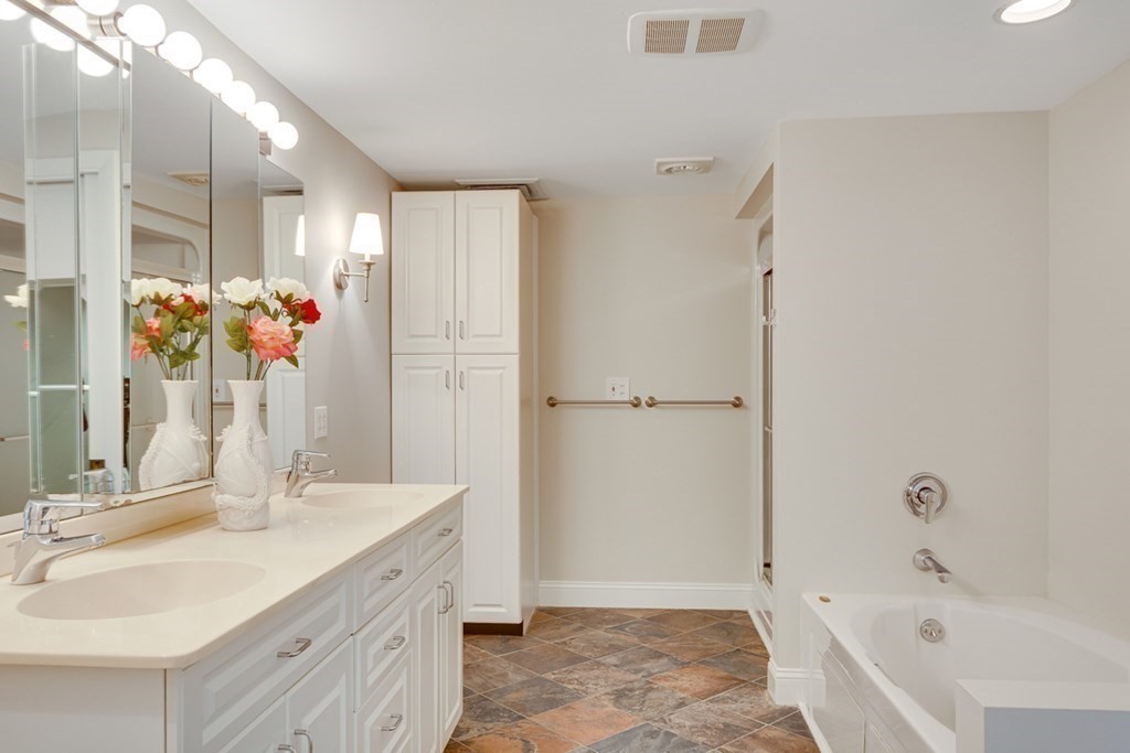 65 Longfellow Road Newton, MA 02462 - Photo 19 of 38 a bathroom with a tub sink and mirror