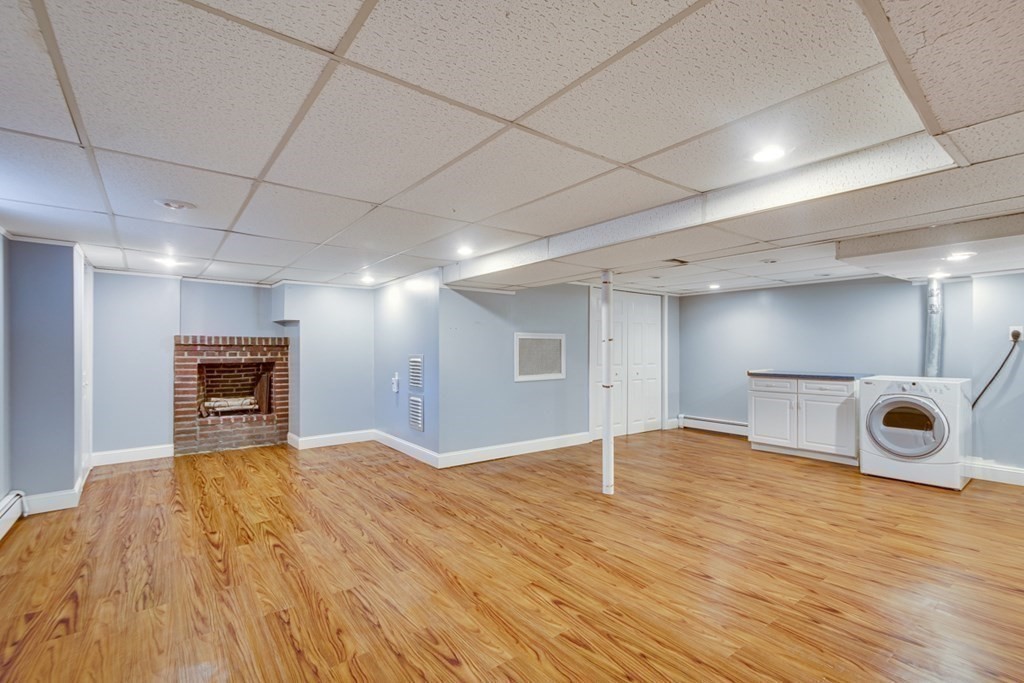 65 Longfellow Road Newton, MA 02462 - Photo 25 of 38 a view of an empty room with wooden floor