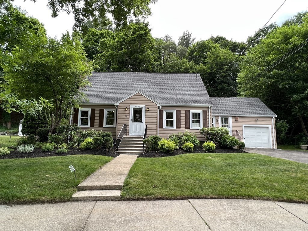 65 Longfellow Road Newton, MA 02462 - Photo 28 of 38 a front view of a house with a garden