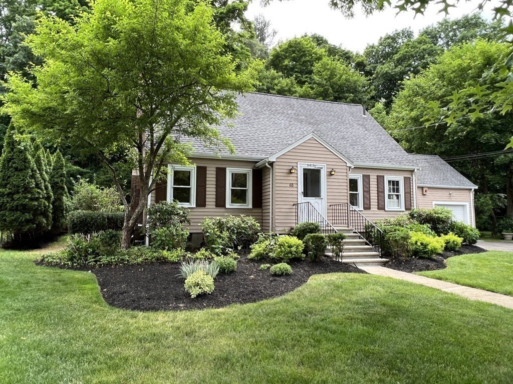 65 Longfellow Road Newton, MA 02462 - Photo 29 of 38 a view of a house with a yard and plants