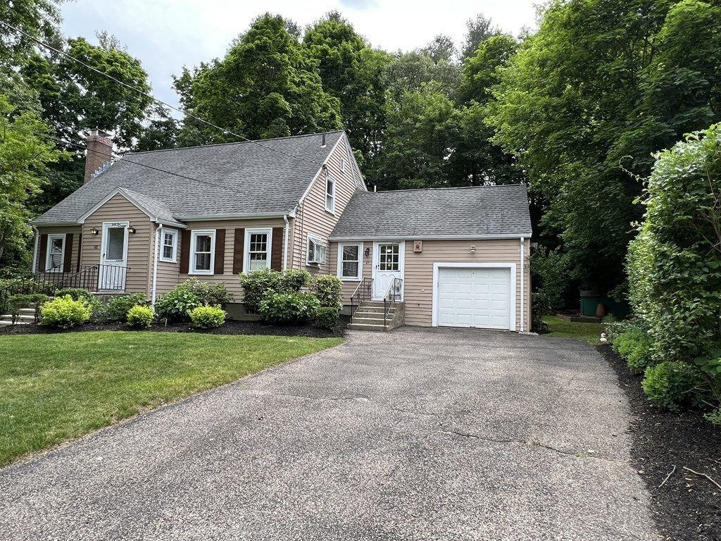 65 Longfellow Road Newton, MA 02462 - Photo 30 of 38 a front view of a house with a yard and garage