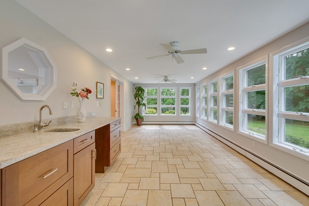 65 Longfellow Road Newton, MA 02462 - Photo 3 of 38 a large kitchen with stainless steel appliances granite countertop a sink and a large mirror