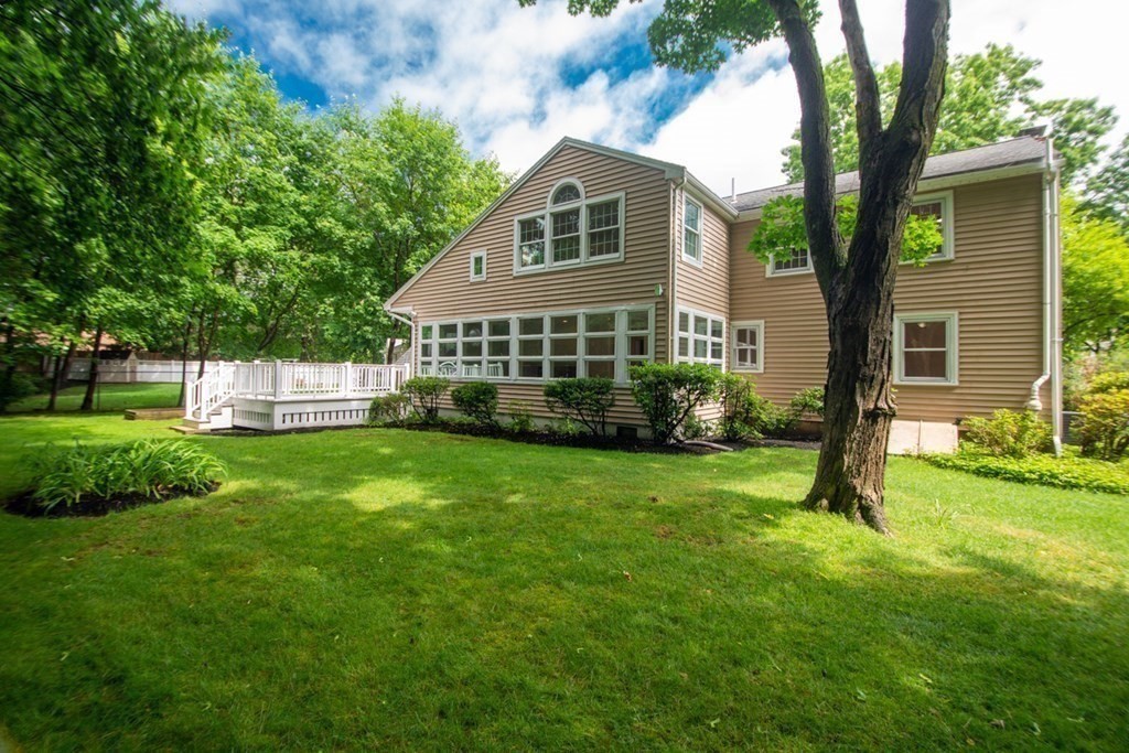 65 Longfellow Road Newton, MA 02462 - Photo 32 of 38 front view of a house with a yard