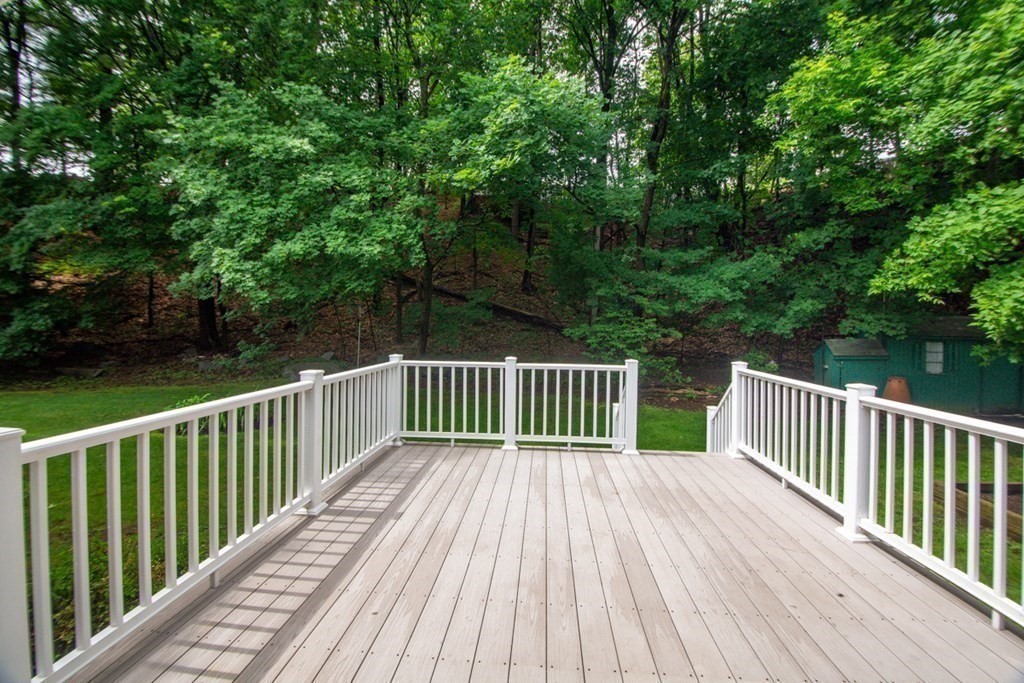 65 Longfellow Road Newton, MA 02462 - Photo 34 of 38 a balcony with view of trees in the background