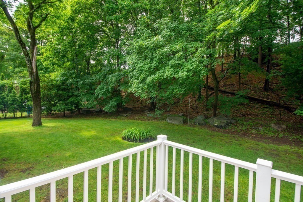 65 Longfellow Road Newton, MA 02462 - Photo 35 of 38 a view of a wooden deck and backyard