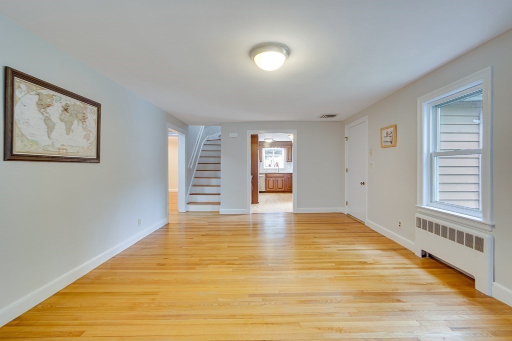 65 Longfellow Road Newton, MA 02462 - Photo 6 of 38 a view of an empty room with wooden floor and a window