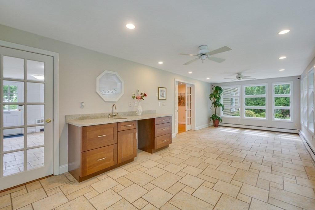 65 Longfellow Road Newton, MA 02462 - Photo 8 of 38 a large bathroom with a sink a vanity and a large mirror