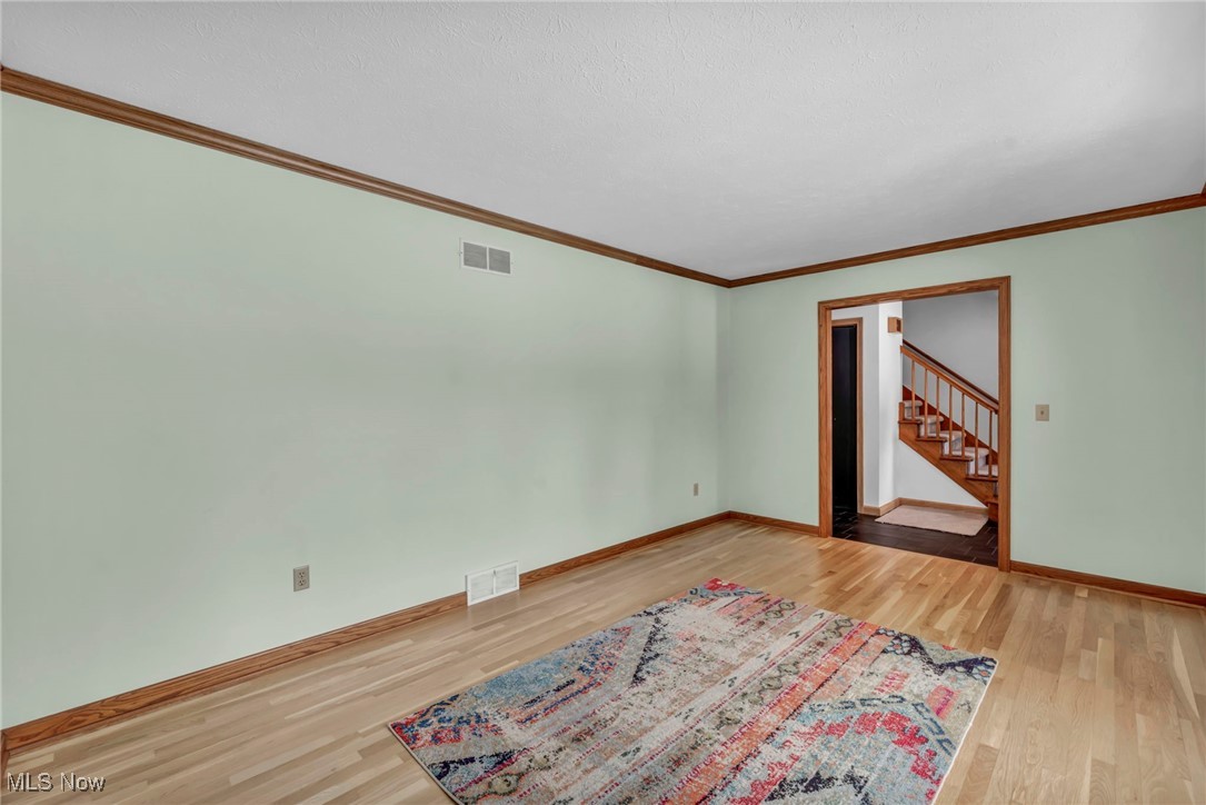 167 Spell Road Kent, OH 44240 - Photo 8 of 48 Great room featuring light hardwood / wood-style floors and ornamental molding