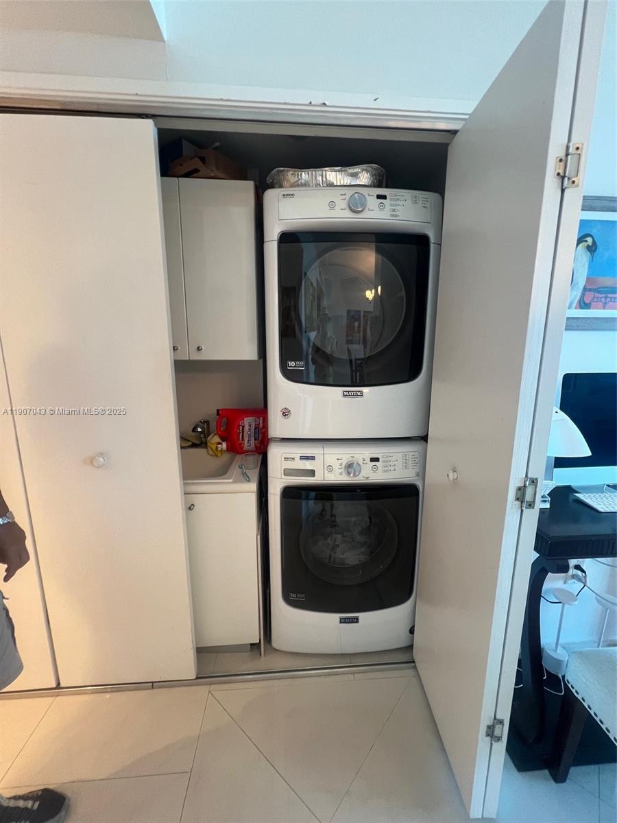 9401 Collins Avenue, Unit 801 Surfside, FL 33154 - Photo 22 of 51 a utility room with dryer and washer