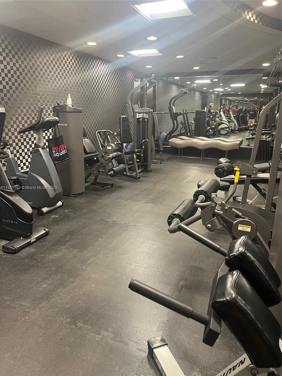 9401 Collins Avenue, Unit 801 Surfside, FL 33154 - Photo 31 of 51 a view of a room with gym equipment